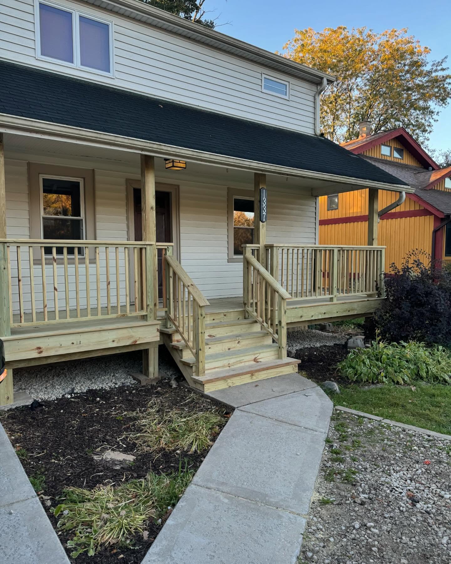 Front porch remodel with wraparound railing by ADR Construction
