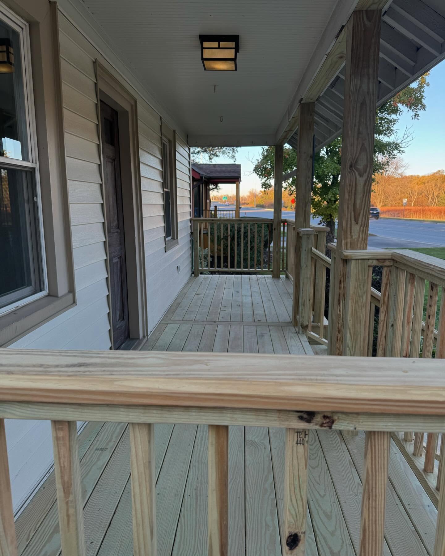 Covered porch with cedar posts and clean decking lines