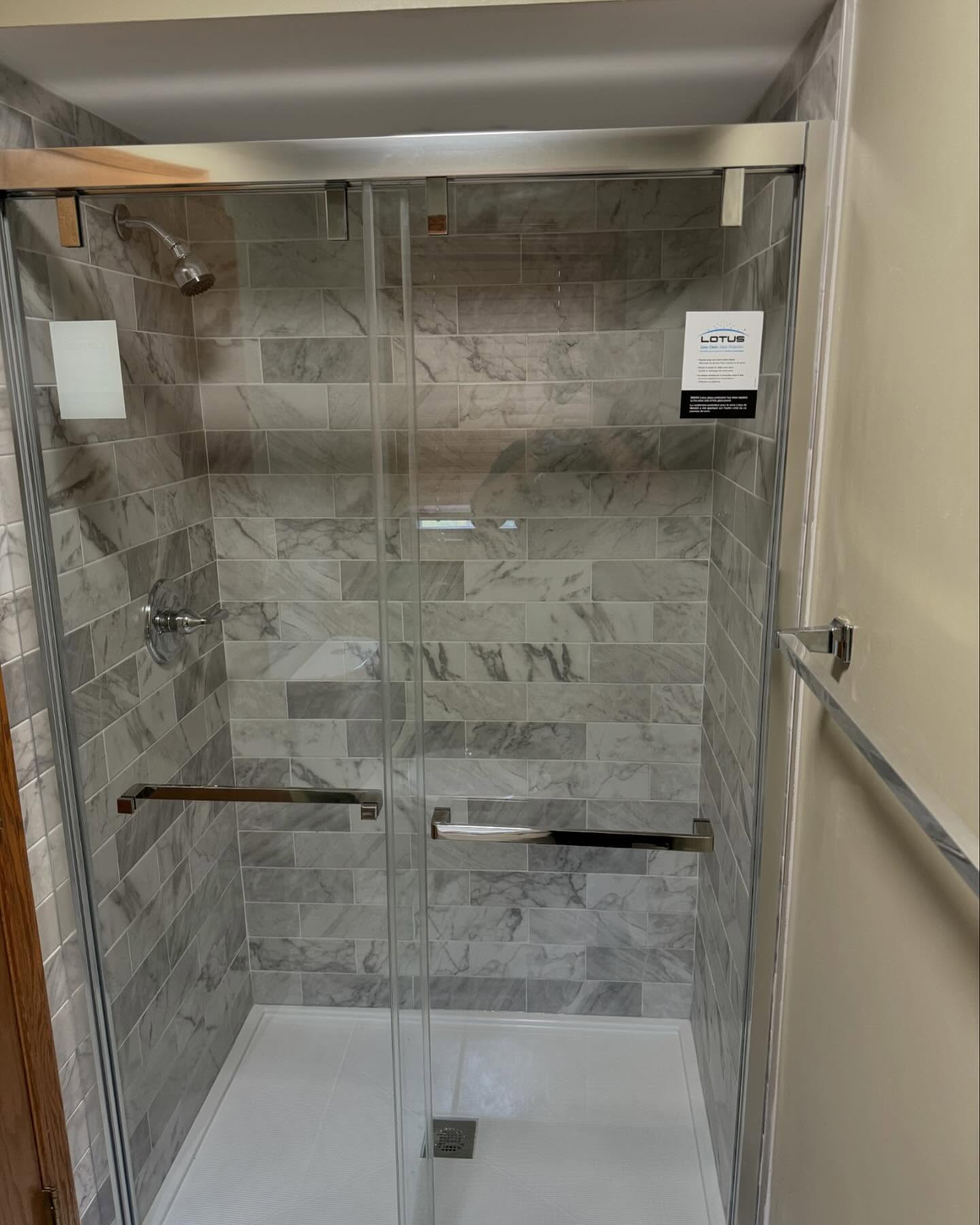 Quick bathroom remodel with marble-look tile by ADR Construction