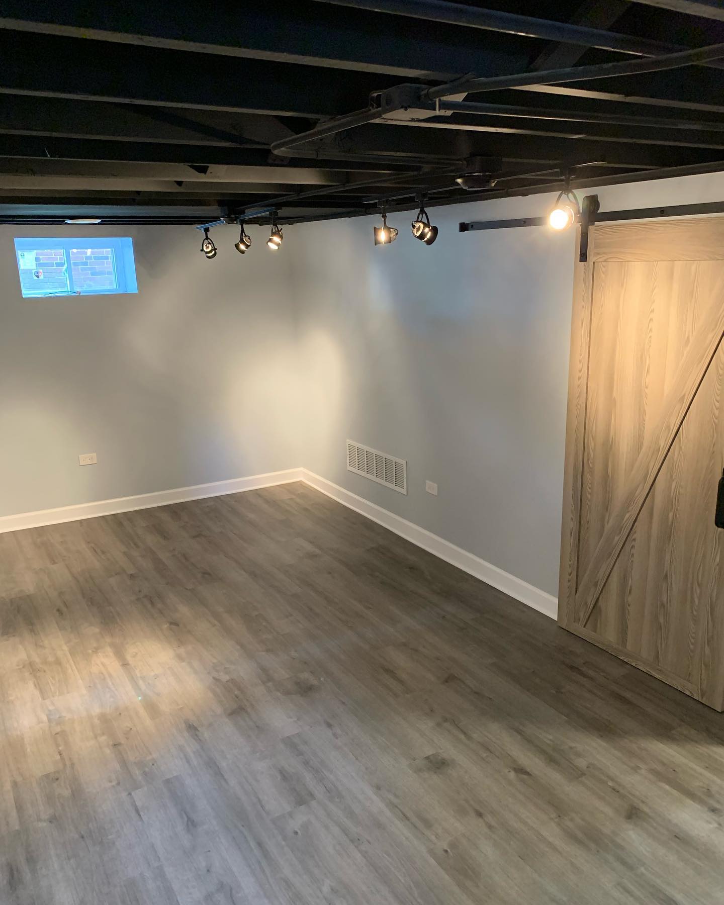 Finished basement living space by ADR Construction