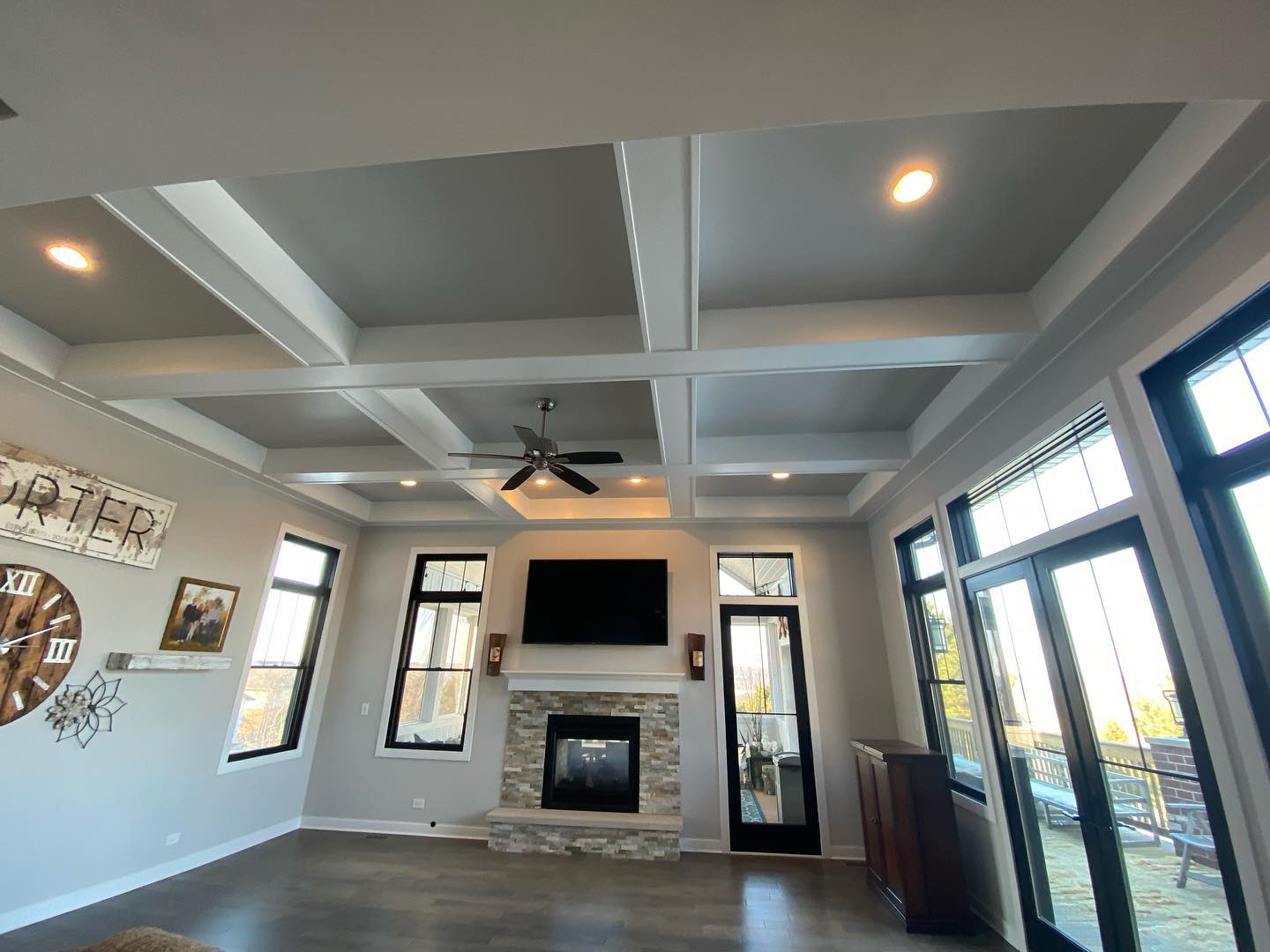 Custom coffered ceiling and fireplace wall by ADR Construction