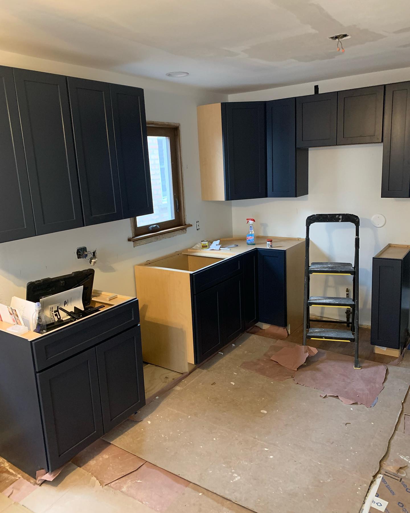 Kitchen cabinet installation in progress by ADR Construction
